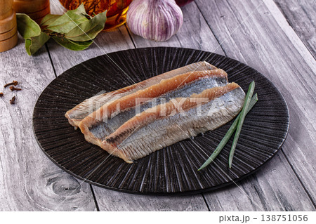 Marinated salted herring fillet slices Marinated salted herring fillet slices 138751056