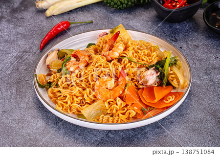 Asian noodles with seafood and vegetables Asian noodles with seafood and vegetables 138751084