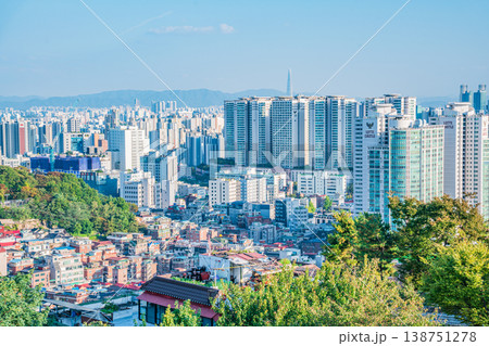 Seoul, South Korea - Oct. 25, 2025 : High-angle view of Seoul city skyline with dense office buildings and mountains in Jongno. Seoul, South Korea - Oct. 25, 2025 : High-angle view of Seoul city skyline with dense office buildings and mountains in Jongno. 138751278