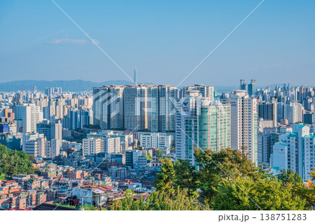 Seoul, South Korea - Oct. 25, 2025 : High-angle view of Seoul city skyline with dense office buildings and mountains in Jongno. Seoul, South Korea - Oct. 25, 2025 : High-angle view of Seoul city skyline with dense office buildings and mountains in Jongno. 138751283