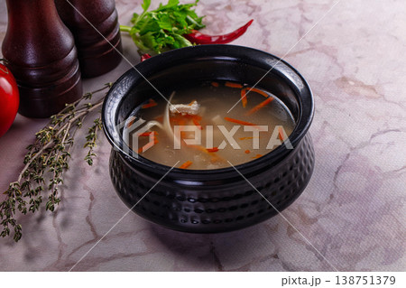 Clear chicken soup with noodles 138751379