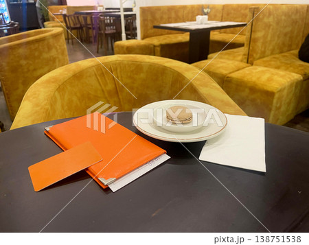 a table with a plate and a napkin on it 138751538