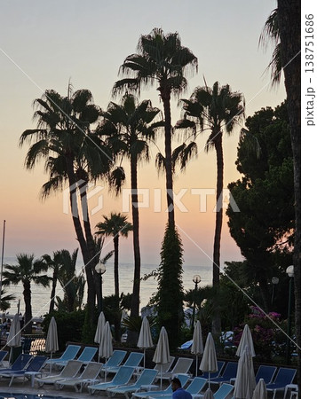 Sea beach sunset light with coconut palm tree againt blue sky summer vacation background Sea beach sunset light with coconut palm tree againt blue sky summer vacation background 138751686