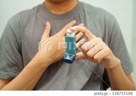 Asthma and chronic obstructive pulmonary disease COPD, Asian teenage using metered dose inhaler MDI. Asthma and chronic obstructive pulmonary disease COPD, Asian teenage using metered dose inhaler MDI. 138753198