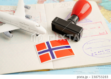 Norway passport with approved stamp on document for tourism to immigration at airport in country. Norway passport with approved stamp on document for tourism to immigration at airport in country. 138753283