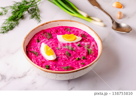 Cold summer soup of beets, yogurt, cucumbers, eggs and dill. 138753810