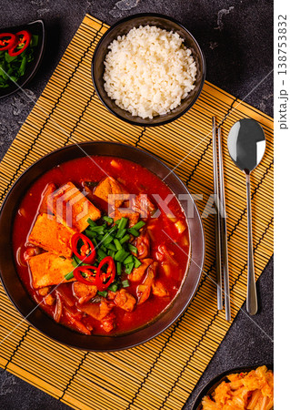 Korean traditional food, spicy kimchi soup (kimchi tige) with pork and tofu cheese. Korean traditional food, spicy kimchi soup (kimchi tige) with pork and tofu cheese. 138753832