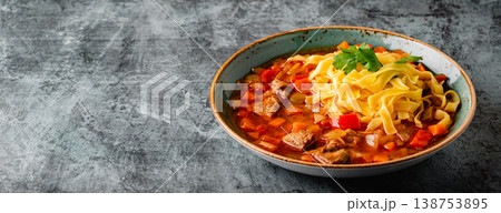 Lagman soup with lamb, homemade noodles and vegetables. Lagman soup with lamb, homemade noodles and vegetables. 138753895