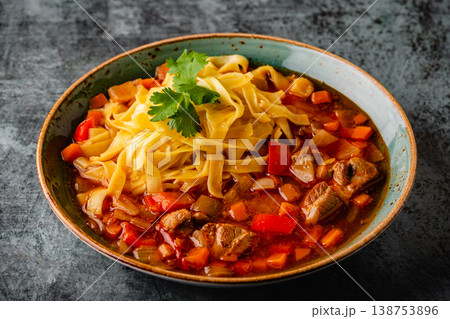 Lagman soup with lamb, homemade noodles and vegetables. Lagman soup with lamb, homemade noodles and vegetables. 138753896
