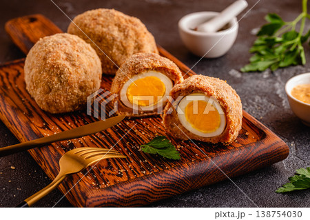 Traditional Scotch Eggs on a wooden board. 138754030
