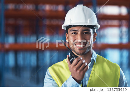Man, radio and portrait in warehouse for logistics, storage site and contact with safety inspection. Male person, communication and tech with smile, helmet and shipping at distribution plant 138755439