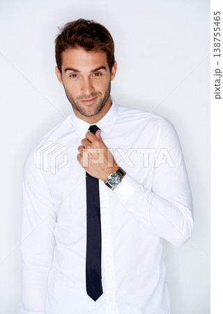 Portrait, fashion and a business man getting ready for corporate work in studio on a white background. Face, shirt and tie with a confident young employee dressing in a professional clothes outfit Portrait, fashion and a business man getting ready for corporate work in studio on a white background. Face, shirt and tie with a confident young employee dressing in a professional clothes outfit 138755465