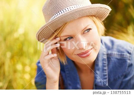 Countryside, thinking and woman with sunshine, ideas and adventure with tourism, summer and calm. Person, travelling or girl with happiness, peace and hat with fresh air, relax or journey with joy 138755513