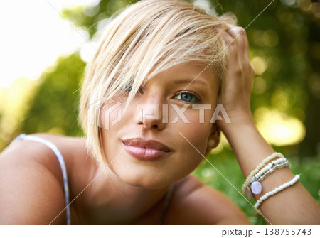 Relax, nature and portrait of happy woman in garden for holiday in summer on outdoor picnic. Smile, freedom and face of girl on grass in park for weekend in countryside with sunshine on vacation. Relax, nature and portrait of happy woman in garden for holiday in summer on outdoor picnic. Smile, freedom and face of girl on grass in park for weekend in countryside with sunshine on vacation. 138755743