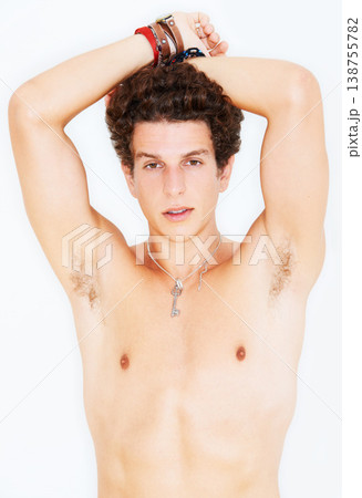 Portrait, skin and the body of a man in studio isolated on a white background for natural masculinity. Fitness, health and wellness with a shirtless young model looking confident at his bare physique 138755782