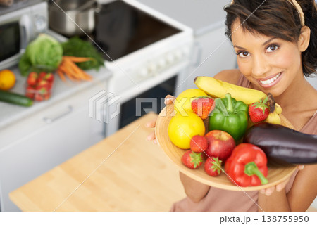 Portrait, space and vegetables with a woman in the kitchen of her home for nutrition, diet or meal preparation. Face, smile and a recipe for cooking healthy food with a young person in her apartment 138755950