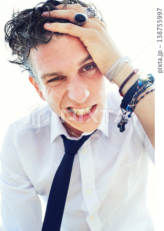 Portrait, punk and rocker with jewelry, man and expression with character, Halloween costume and stylish outfit. Face, trendy clothes and guy with energy, necktie and facial with emotion and reaction Portrait, punk and rocker with jewelry, man and expression with character, Halloween costume and stylish outfit. Face, trendy clothes and guy with energy, necktie and facial with emotion and reaction 138755997