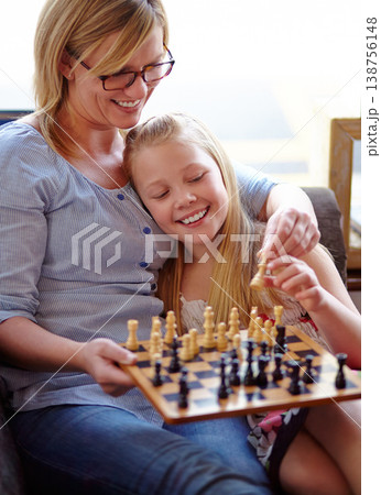 Happy, chess and a mother and child with a game for competition, strategy or thinking. Smile, family and a mom, girl or kid on a home sofa with a board for gaming, education and learning a hobby Happy, chess and a mother and child with a game for competition, strategy or thinking. Smile, family and a mom, girl or kid on a home sofa with a board for gaming, education and learning a hobby 138756148
