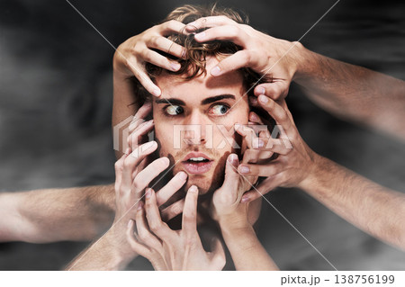 Scared, schizophrenia and man with hands, mental health or bipolar in studio isolated on a black background. Face, smoke and person with fear, horror or abuse drugs, hallucination and sick fantasy Scared, schizophrenia and man with hands, mental health or bipolar in studio isolated on a black background. Face, smoke and person with fear, horror or abuse drugs, hallucination and sick fantasy 138756199