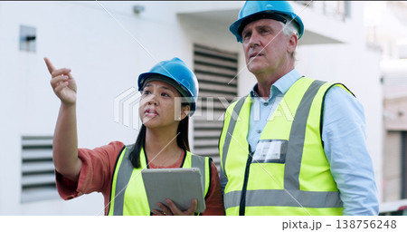 Construction, team and tablet for inspection with people at job site, mentor and apprentice with communication. Architecture, engineering and digital floor plan, old man and woman outdoor in meeting Construction, team and tablet for inspection with people at job site, mentor and apprentice with communication. Architecture, engineering and digital floor plan, old man and woman outdoor in meeting 138756248
