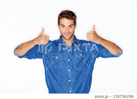 Portrait, fashion and thumbs up with a man in studio isolated on a white background for success or support. Hands, emoji for thank you and a young model indoor to gesture as a winner with motivation Portrait, fashion and thumbs up with a man in studio isolated on a white background for success or support. Hands, emoji for thank you and a young model indoor to gesture as a winner with motivation 138756296