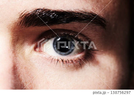 Macro, portrait and eye of man, vision and healthy eyesight, contact lens or retina for optometry. Face, closeup and iris of serious human, eyelash or eyebrow for ophthalmology, blue eyeball or skin Macro, portrait and eye of man, vision and healthy eyesight, contact lens or retina for optometry. Face, closeup and iris of serious human, eyelash or eyebrow for ophthalmology, blue eyeball or skin 138756297