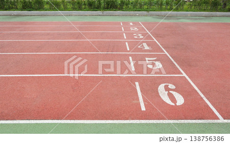 a Red Running Track with White Lane Markings a Red Running Track with White Lane Markings 138756386