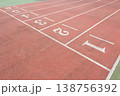 a Red Running Track with White Lane Markings 138756392