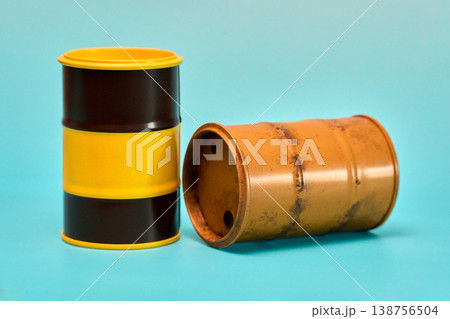 Two Cylindrical Barrels on Blue Background 138756504
