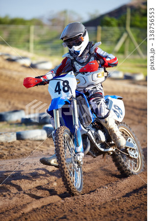 Person, motorcycle and dirt race track adventure as .professional in action, danger or fearless risk. Bike rider, off road course and fast speed competition rally, extreme sport gear on sand path Person, motorcycle and dirt race track adventure as .professional in action, danger or fearless risk. Bike rider, off road course and fast speed competition rally, extreme sport gear on sand path 138756553