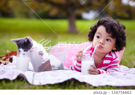 Milk, picnic and a girl in the park with her cat together for love, care or bonding during summer. Drinking straw, kitten or kids and a happy young child in the garden having fun with her pet animal Milk, picnic and a girl in the park with her cat together for love, care or bonding during summer. Drinking straw, kitten or kids and a happy young child in the garden having fun with her pet animal 138756662