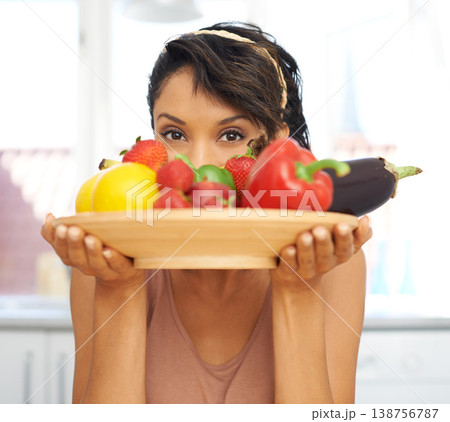 Portrait, eyes and vegetables with a woman in the kitchen of her home for nutrition, diet or meal preparation. Health, ingredients and a recipe for cooking food with a young person in her apartment Portrait, eyes and vegetables with a woman in the kitchen of her home for nutrition, diet or meal preparation. Health, ingredients and a recipe for cooking food with a young person in her apartment 138756787
