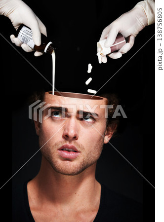Hands pour medicine in head of man, mental health and treatment in studio isolated on a black background. Pills, sick person and antidepressant drugs or medication for depression, anxiety and stress 138756805