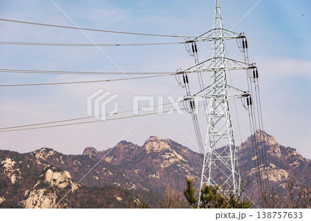 High Voltage Transmission Tower with Bukhansan Mountain Background, Korea. High Voltage Transmission Tower with Bukhansan Mountain Background, Korea. 138757633