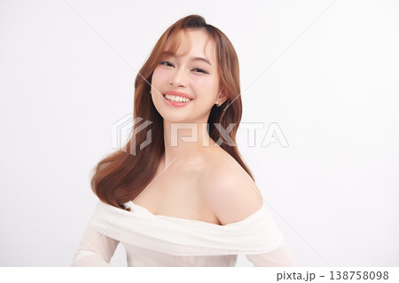 A beautiful young Asian woman with clean, fresh skin against a white background. Skincare, facial treatment, cosmetology, beauty, and spa. An elegant portrait of an Asian woman. A beautiful young Asian woman with clean, fresh skin against a white background. Skincare, facial treatment, cosmetology, beauty, and spa. An elegant portrait of an Asian woman. 138758098