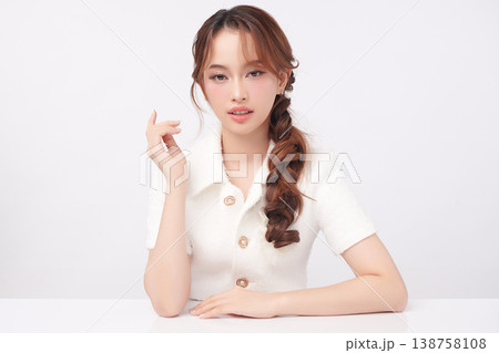 A beautiful young Asian woman with clean, fresh skin against a white background. Skincare, facial treatment, cosmetology, beauty, and spa. An elegant portrait of an Asian woman. A beautiful young Asian woman with clean, fresh skin against a white background. Skincare, facial treatment, cosmetology, beauty, and spa. An elegant portrait of an Asian woman. 138758108