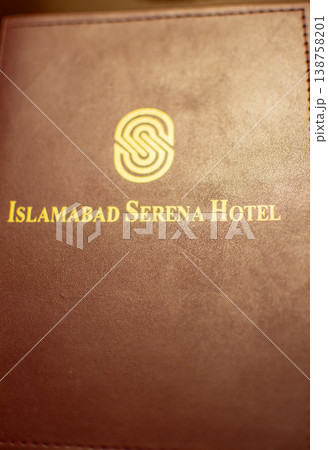 Brown leather menu cover with gold embossed logo of luxurious 5 star Serena hotel in Islamabad, Pakistan Brown leather menu cover with gold embossed logo of luxurious 5 star Serena hotel in Islamabad, Pakistan 138758201