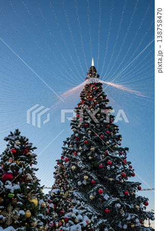 Christmas tree and New Year decorations on the town square on a frosty winter day. Christmas tree and New Year decorations on the town square on a frosty winter day. 138758470