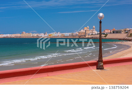 Cadiz cathedral skyline and sandy beach view in Cadiz, Spain 138759204