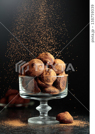 Chocolate truffles sprinkled with cocoa powder. Chocolate truffles sprinkled with cocoa powder. 138759339