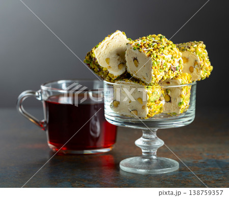 Turkish delights with black tea on a dark  background. 138759357
