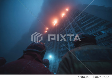 Fire brigade crew fights multi story building blaze while rescuers work to save lives 138759682