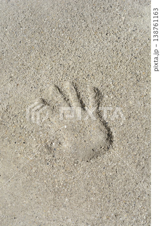 Handprint Impression in Concrete Surface Handprint Impression in Concrete Surface 138761163