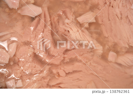 Close up of canned tuna pieces in brine Close up of canned tuna pieces in brine 138762361