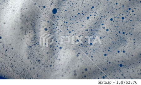 Bubbles forming in a mixture at a cleaning or washing activity in bright light Bubbles forming in a mixture at a cleaning or washing activity in bright light 138762576