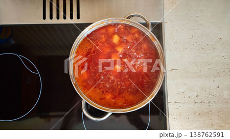 homemade borscht is cooked in a saucepan on a home stove homemade borscht is cooked in a saucepan on a home stove 138762591