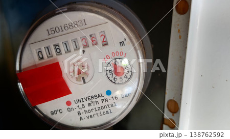 Water meter showing usage readings in a residential location Water meter showing usage readings in a residential location 138762592
