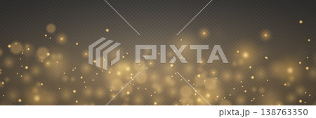Golden sparkling particles creating festive bokeh effect overlaying dark background 138763350