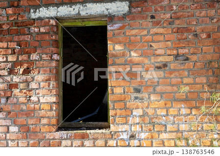 Abandoned threshold with sunlight. Old brick gateway inviting curiosity amid decay and light 138763546