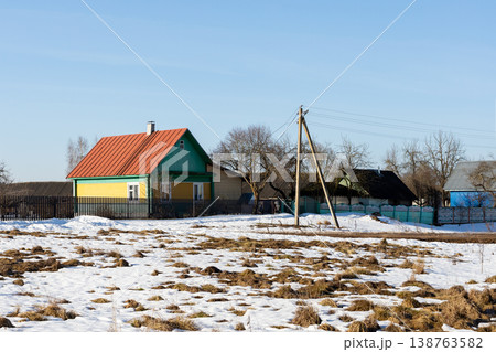 Idyllic snowcovered rural residence featuring lively bird presence and signs of seasonal transition Idyllic snowcovered rural residence featuring lively bird presence and signs of seasonal transition 138763582